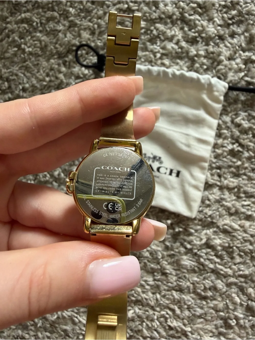 COACH Gold-Tone Signature Pattern Bangle Watch with White Dial